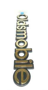 One Gold Black Oldsmobile Door Emblem GM 15957900